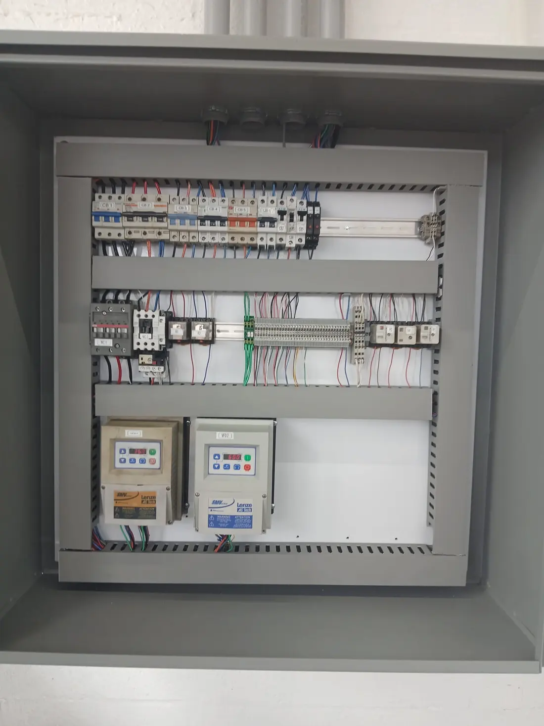 Dual variable frequency drive control panel built and wired by Ogun