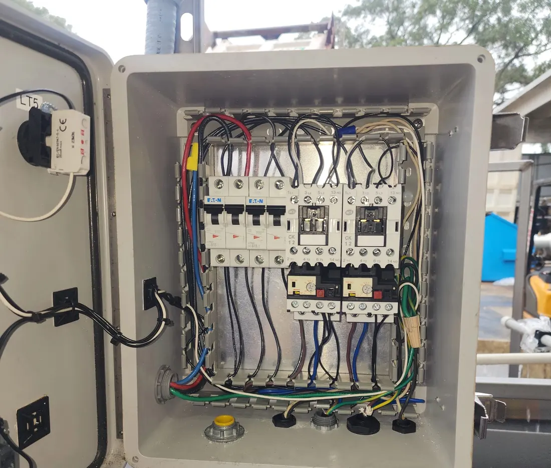 Control panel with Eaton breakers, contactors, and overloads, wired and labeled